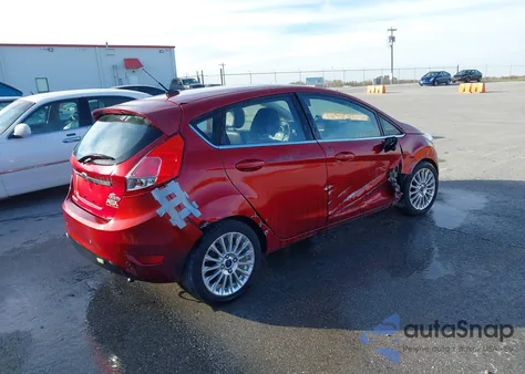 2014 Ford Fiesta Titanium z USA, uszkodzony, nr VIN 3FADP4FJ2EM106464
